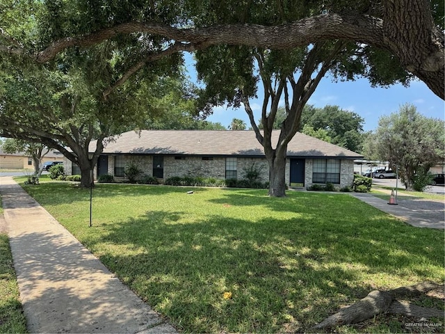 ranch-style home with a front yard