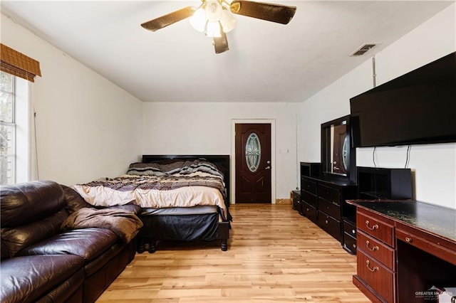 bedroom featuring ceiling fan and light wood-type flooring