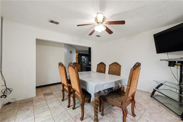 dining room featuring ceiling fan