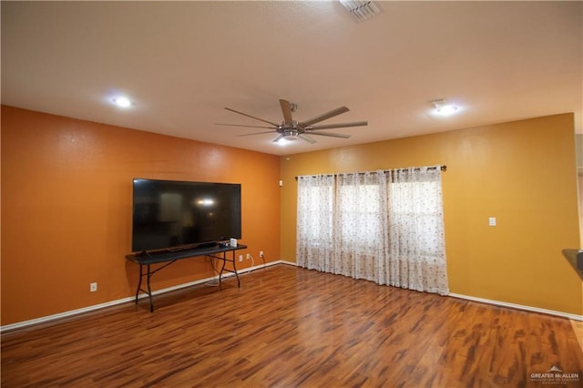 3109 Viola Dr, Mission, TX 78574 - unfurnished living room with wood finished floors, ceiling fan, recessed lighting, and baseboards