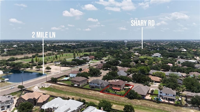 3109 Viola Dr, Mission, TX 78574 - aerial view of residential area with property boundaries highlighted and a large body of water