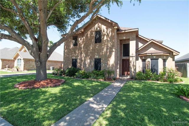 3109 Viola Dr, Mission, TX 78574 - view of front of house with a front yard and brick siding