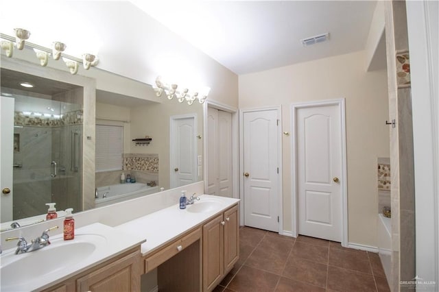 3109 Viola Dr, Mission, TX 78574 - full bath with a garden tub, double vanity, a shower stall, and tile patterned flooring