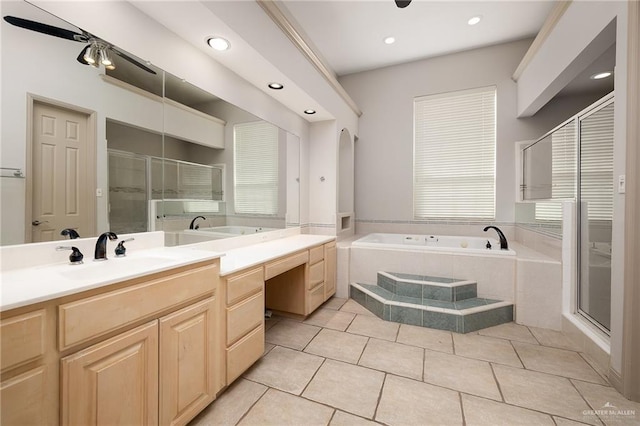 bathroom with tile patterned floors, vanity, and separate shower and tub