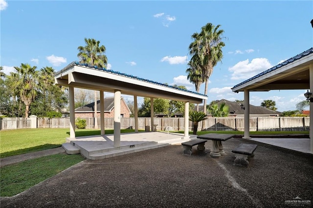 view of community with a patio area and a lawn