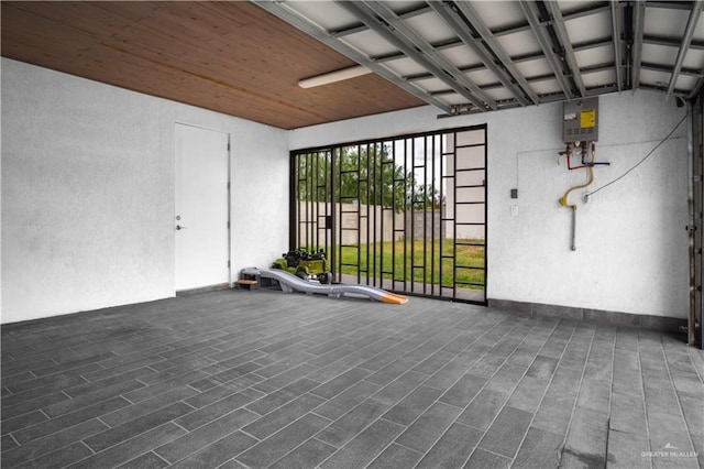 6706 N 11th Ln, Mcallen, TX 78504 - garage featuring a textured wall and water heater