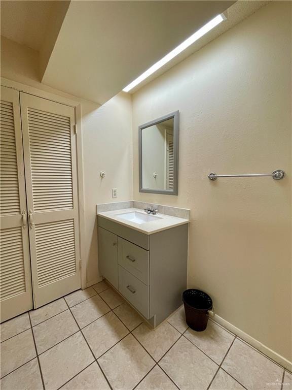 bathroom with tile patterned flooring and vanity