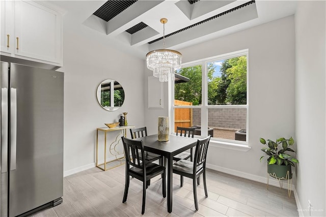 5516 N Crown Pt, Pharr, TX 78577 - dining space with wood tiled floors, baseboards, a chandelier, and beamed ceiling