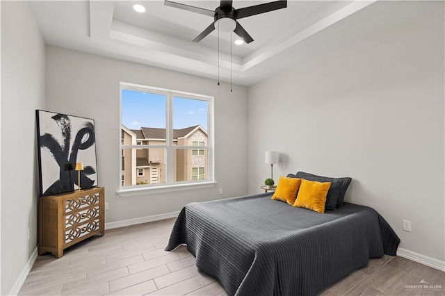 5516 N Crown Pt, Pharr, TX 78577 - spare room with a tray ceiling, a ceiling fan, wood finished floors, baseboards, and recessed lighting