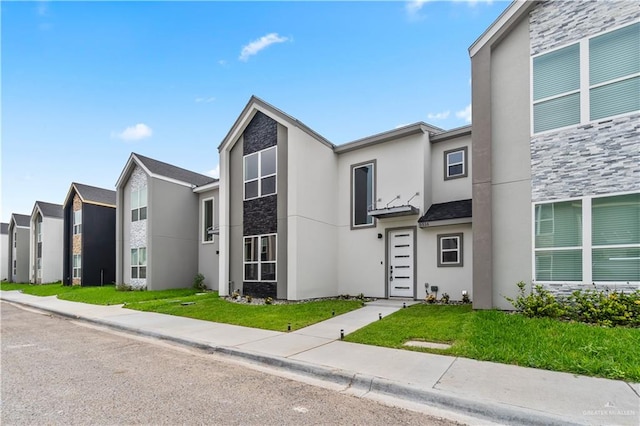 5516 N Crown Pt, Pharr, TX 78577 - view of front facade featuring stone siding and stucco siding