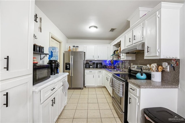 7113 S Habitat Cir E, Pharr, TX 78577 - kitchen featuring appliances with stainless steel finishes, under cabinet range hood, a sink, light tile patterned floors, and tasteful backsplash