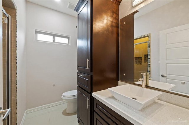 5013 Nevis Dr, Edinburg, TX 78539 - full bathroom featuring toilet, vanity, tile patterned floors, and baseboards