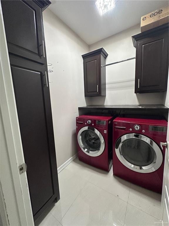 5013 Nevis Dr, Edinburg, TX 78539 - laundry area with separate washer and dryer, light tile patterned flooring, cabinet space, and baseboards
