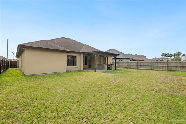 5013 Nevis Dr, Edinburg, TX 78539 - back of property with a patio, stucco siding, a pergola, and roof with shingles