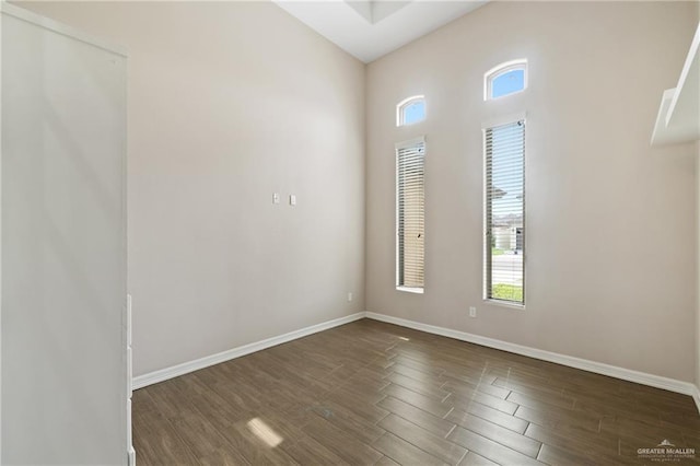 5013 Nevis Dr, Edinburg, TX 78539 - unfurnished room featuring dark wood-type flooring and baseboards