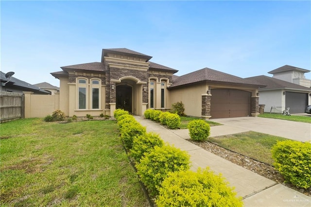 5013 Nevis Dr, Edinburg, TX 78539 - view of front of house featuring stone siding, a garage, concrete driveway, and stucco siding