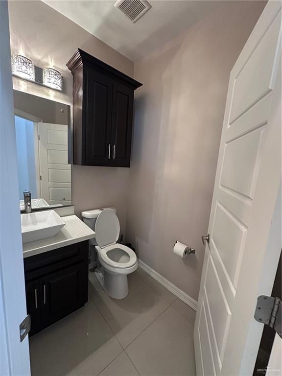 5013 Nevis Dr, Edinburg, TX 78539 - bathroom with toilet, tile patterned floors, vanity, and baseboards