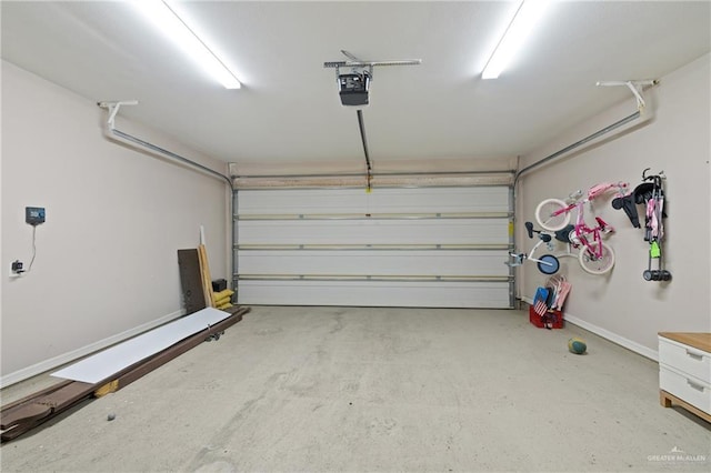 5013 Nevis Dr, Edinburg, TX 78539 - garage featuring baseboards and a garage door opener