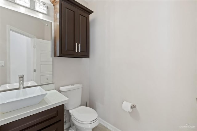 5013 Nevis Dr, Edinburg, TX 78539 - half bath with toilet, vanity, and baseboards