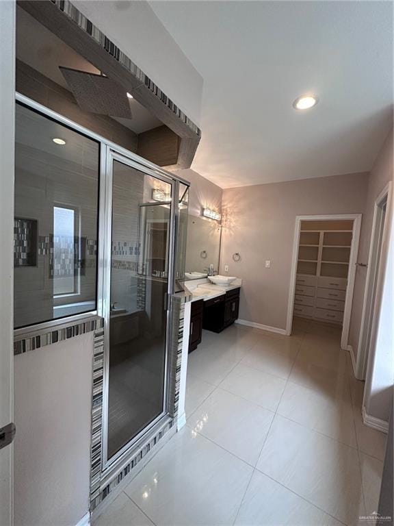 5013 Nevis Dr, Edinburg, TX 78539 - bathroom with a stall shower, vanity, baseboards, tile patterned floors, and recessed lighting