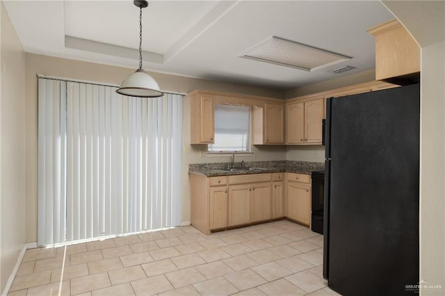 kitchen with hanging light fixtures, sink, light brown cabinets, and black appliances