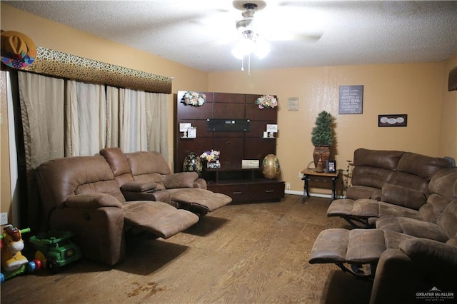 living room featuring a textured ceiling, hardwood / wood-style flooring, and ceiling fan