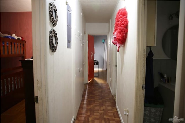 hallway with dark parquet flooring