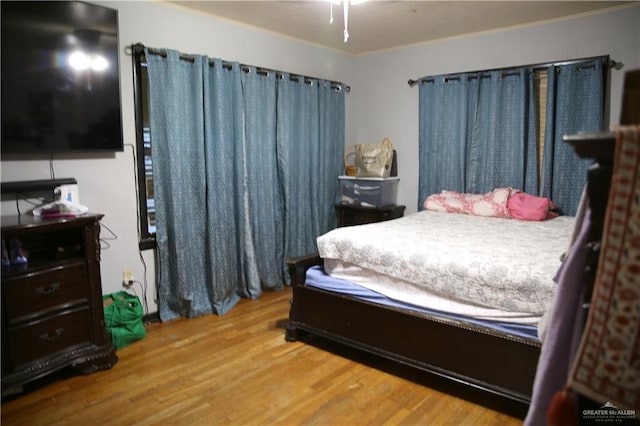 bedroom with hardwood / wood-style floors