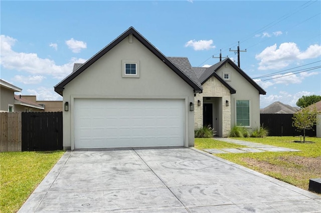 3524 Inez St, Edinburg, TX 78539 - view of front of property featuring stucco siding, concrete driveway, stone siding, and an attached garage