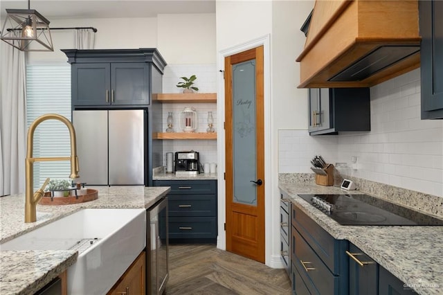 3524 Inez St, Edinburg, TX 78539 - kitchen featuring freestanding refrigerator, black electric cooktop, tasteful backsplash, and wine cooler