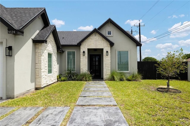 3524 Inez St, Edinburg, TX 78539 - view of front of home featuring stone siding, a shingled roof, and stucco siding