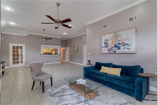 tiled living room with ceiling fan and ornamental molding