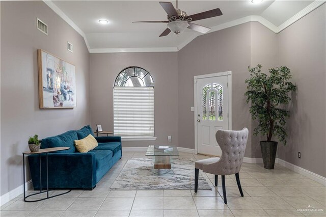 tiled living room with crown molding, ceiling fan, and lofted ceiling