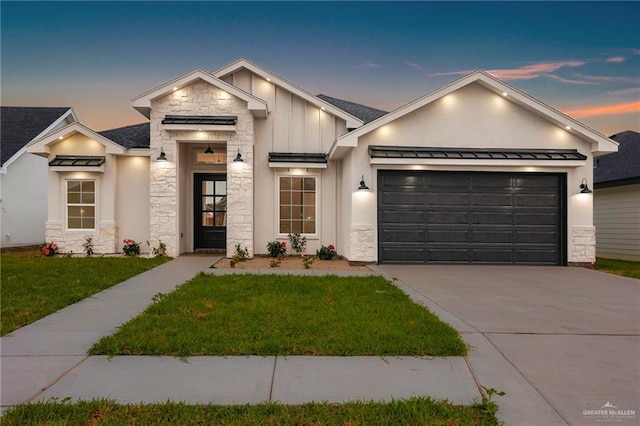 1007 Broken Arrow Dr, Alamo, TX 78516 - modern inspired farmhouse with a garage, a lawn, driveway, stone siding, and board and batten siding