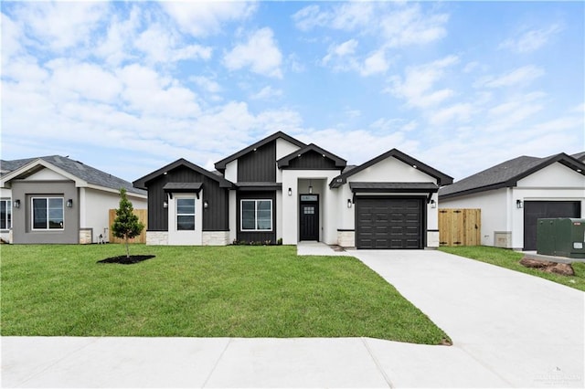 view of front facade with a front yard and a garage