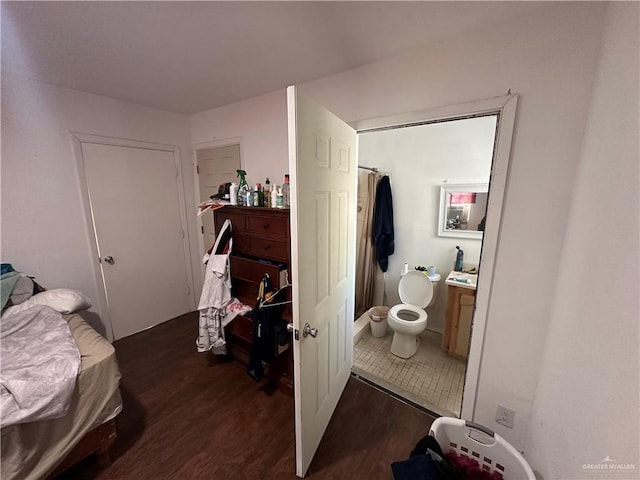 bedroom featuring dark hardwood / wood-style flooring