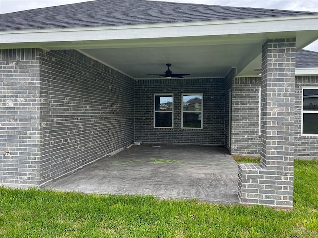 view of patio featuring ceiling fan