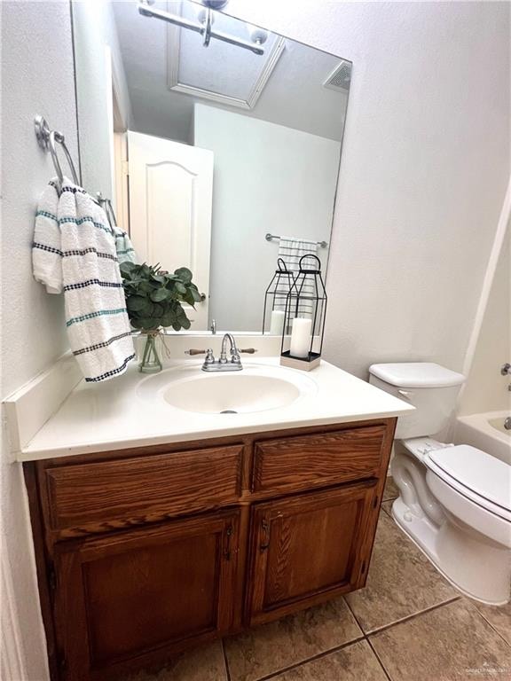 full bathroom featuring tile patterned flooring, shower / bathing tub combination, vanity, and toilet