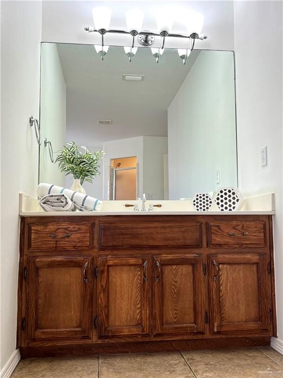 bathroom with tile patterned flooring and vanity