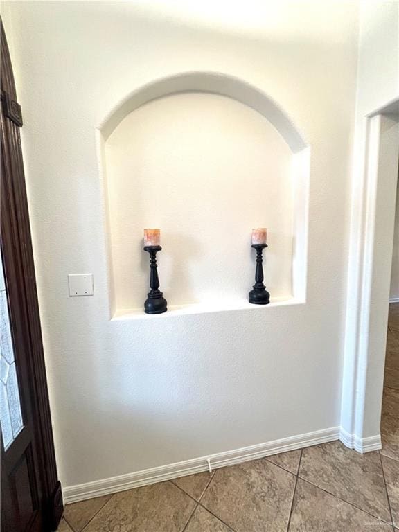 corridor with light tile patterned floors