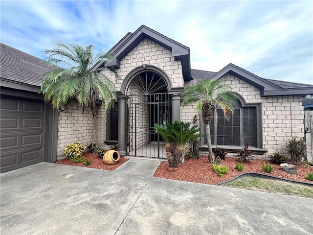 view of front of property with a garage