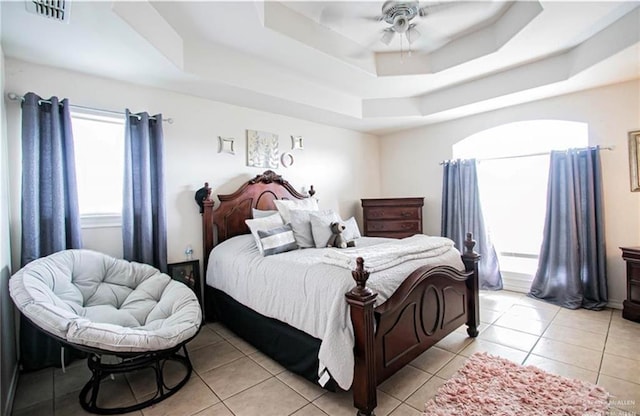 2209 Benito A Ramirez Rd, Edinburg, TX 78542 - bedroom featuring a tray ceiling, light tile patterned floors, and ceiling fan