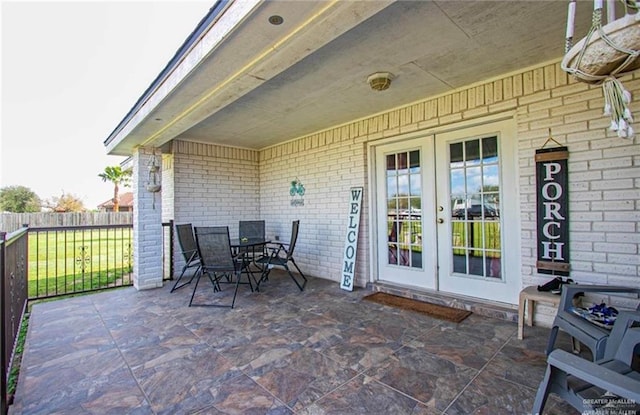 2209 Benito A Ramirez Rd, Edinburg, TX 78542 - view of patio / terrace with french doors and outdoor dining space