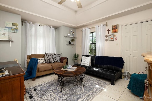 living room featuring light tile patterned floors and ceiling fan