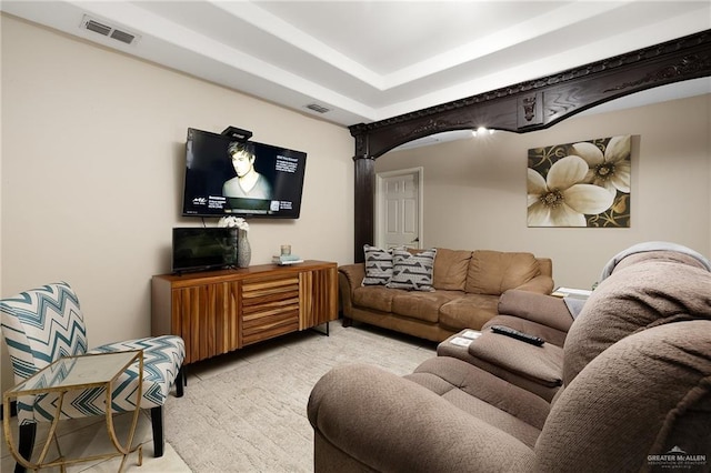 living room with a tray ceiling