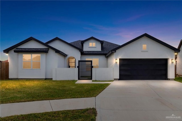 7423 Converse Lk, Brownsville, TX 78520 - view of front of house with an attached garage, concrete driveway, a shingled roof, and stucco siding