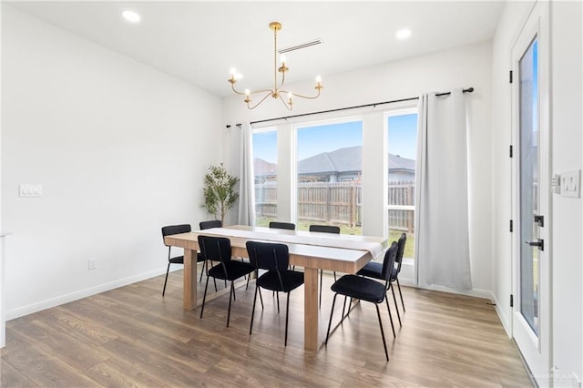 7423 Converse Lk, Brownsville, TX 78520 - dining space featuring a chandelier, wood finished floors, baseboards, and recessed lighting