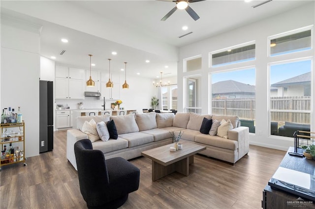 7423 Converse Lk, Brownsville, TX 78520 - living area with ceiling fan, dark wood finished floors, a chandelier, and recessed lighting