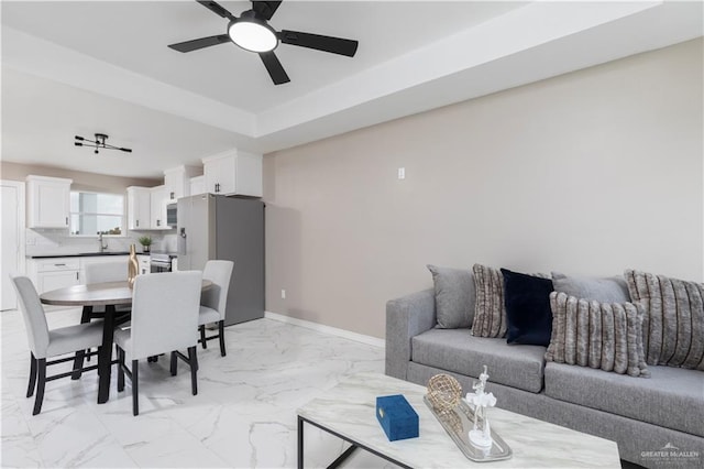 1712 B St, Mission, TX 78572 - living room with a ceiling fan, light marble finish flooring, and baseboards