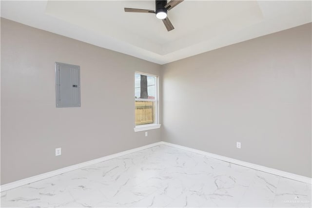 1712 B St, Mission, TX 78572 - spare room featuring electric panel, a tray ceiling, a ceiling fan, and marble look tiles